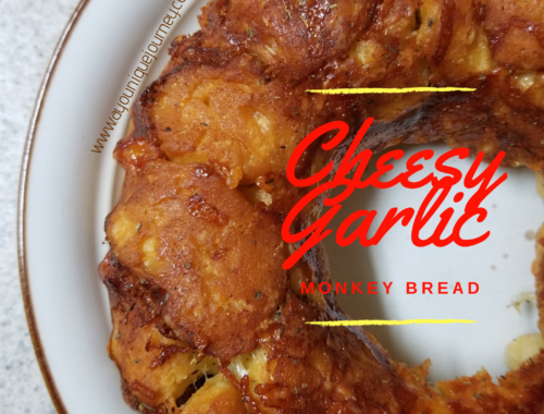 Cheesy Garlic Bread on a cream plate.