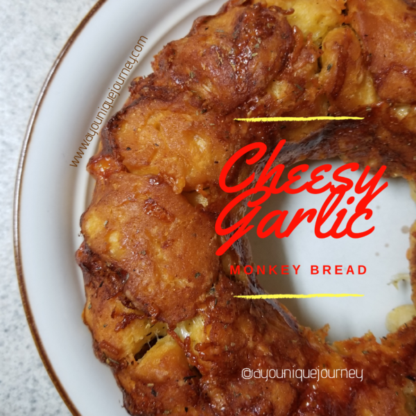 Cheesy Garlic Bread on a cream plate.