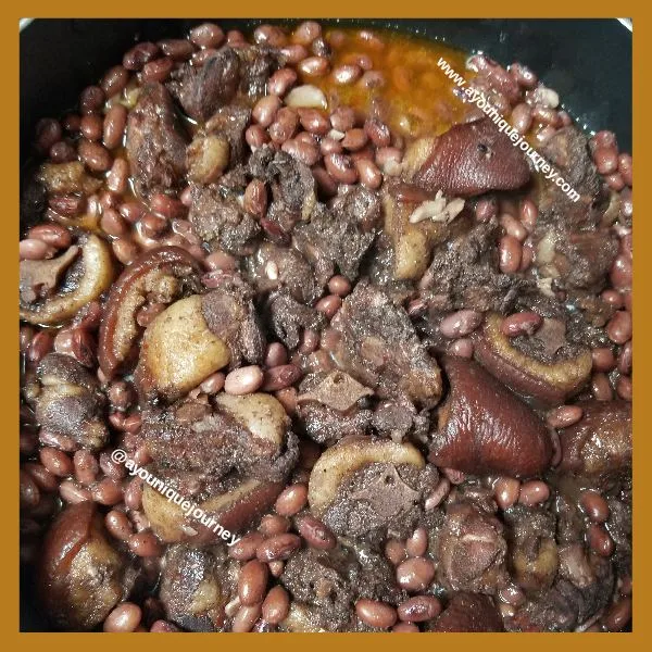 Pig's Tail and Beans after cooking for 1 hour and 20 minutes. There is a small amount of water at the bottom of the pot.
