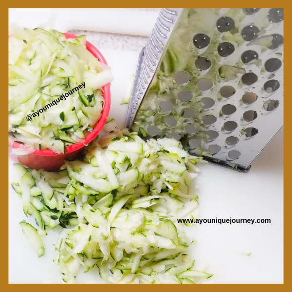 Measuring out the grated Zucchini.