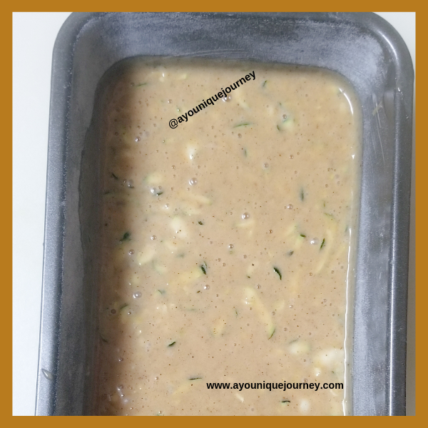 The Zucchini Bread mixture in a prepared loaf pan ready to bake.