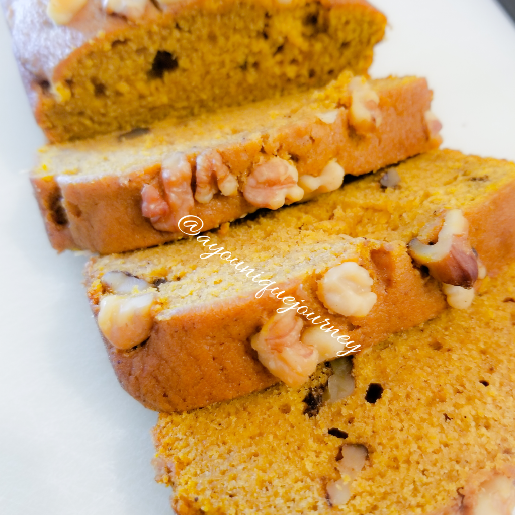 Slices of Pumpkin Bread, showing chopped walnuts on the top.