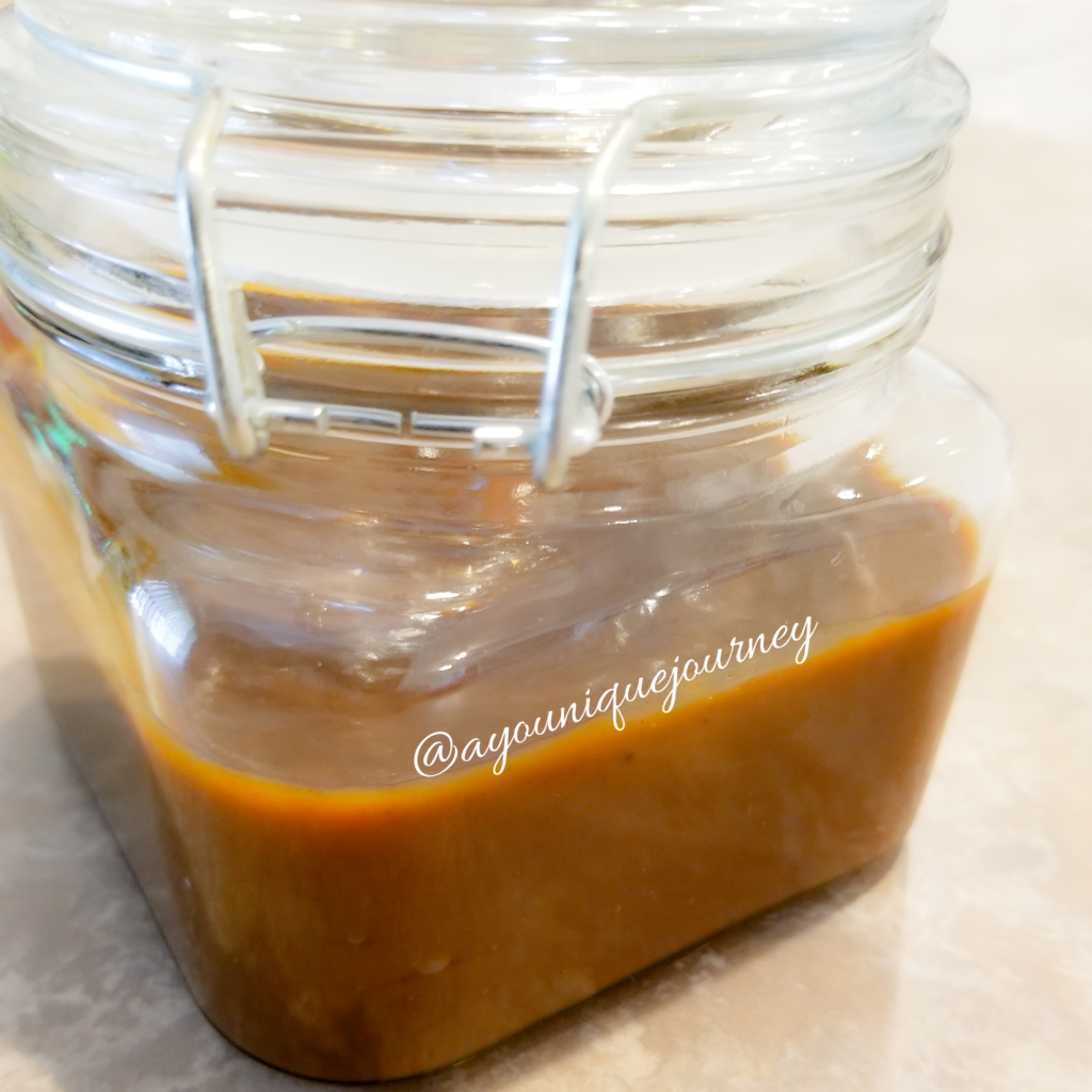 Pumpkin Caramel Sauce in a glass jar.