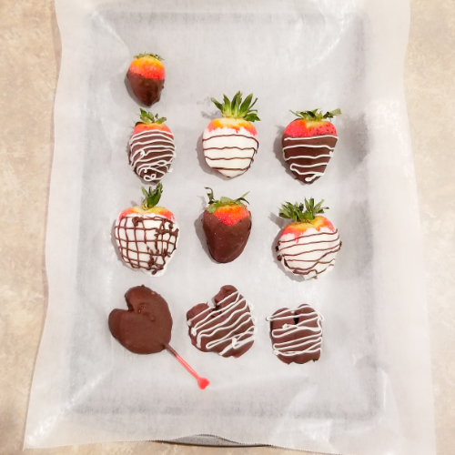 Placed the Chocolate Covered Strawberries on a lined baking sheet with parchment paper.