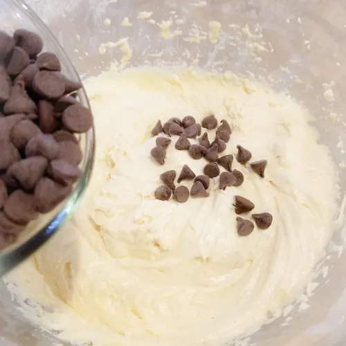 Adding the chocolate chip to the coffee cake batter.