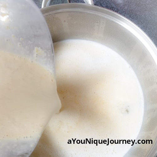 Pouring the blended mixture to the boiling water.