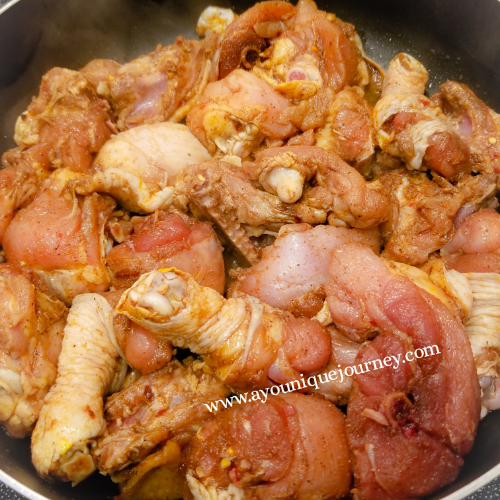 All the chicken pieces in the skillet to make Jamaican Brown Stew Chicken.