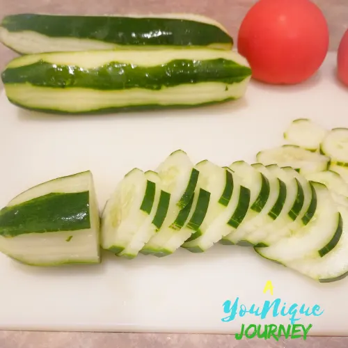Slicing the cucumbers.