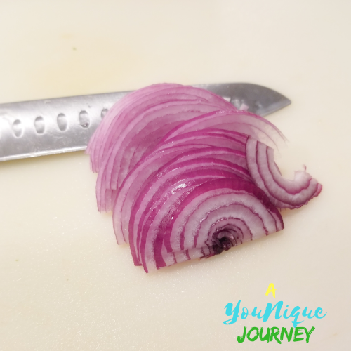 Thinly sliced red onions.