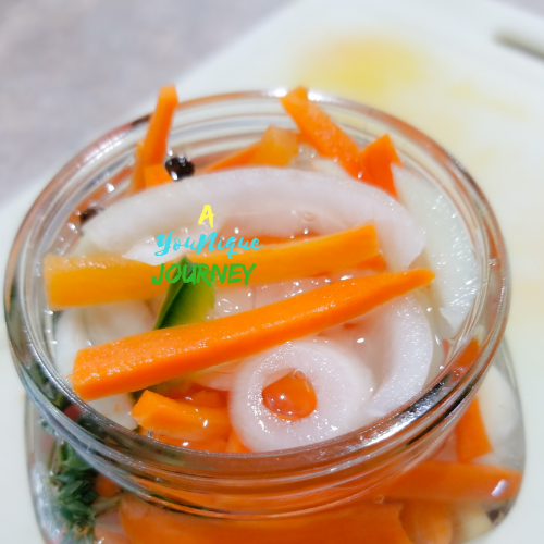 After pouring the vinegar mixture over the vegetables, herbs and spices.