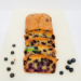 Easy Blueberry Bread Recipe on a white cutting board.