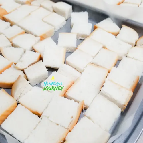 Bread cubes on baking sheet overnight to get stale.