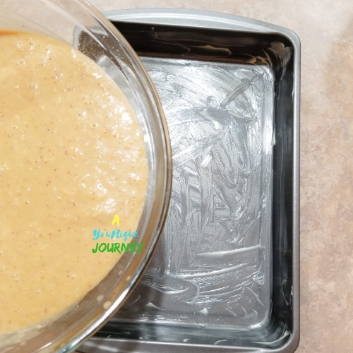 Pouring the Jamaican Toto Coconut Cake batter into the baking pan.