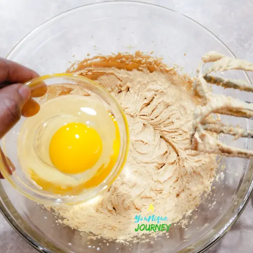 Adding the egg to the peanut butter mixture.