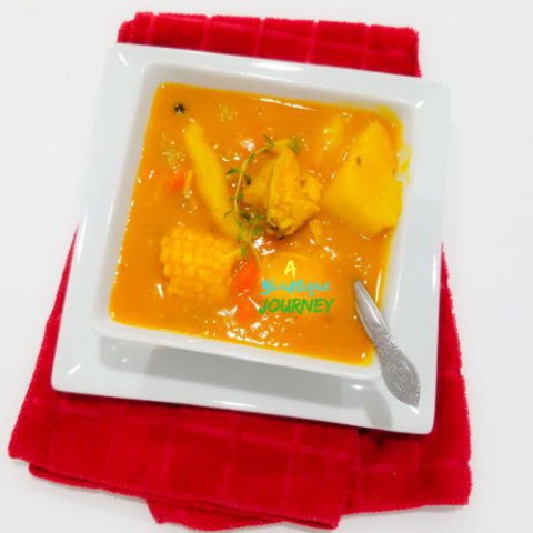 A bowl of Jamaican Chicken Pumpkin Soup.