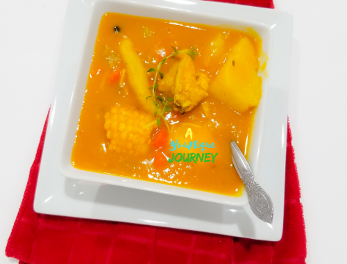 A bowl of Jamaican Chicken Pumpkin Soup.