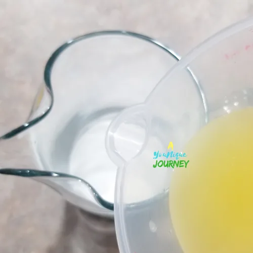 Adding lemon juice to the granulated sugar.