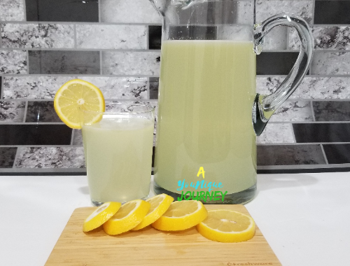 Lemonade Recipe in a glass pitcher.