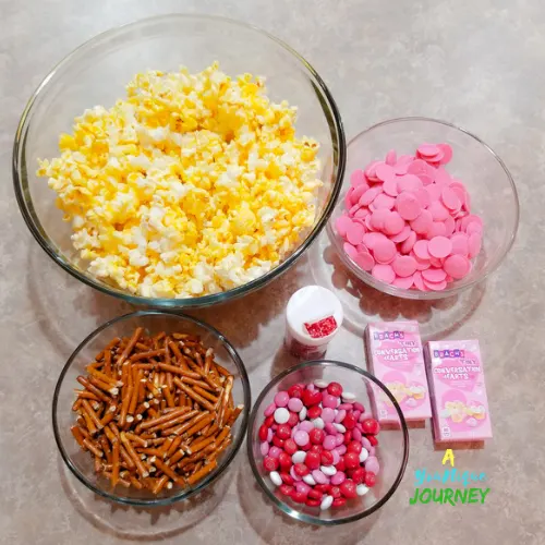 All the ingredients to make the Valentine's Day Popcorn Mix.