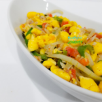 Jamaican Ackee and Saltfish in a white serving bowl.
