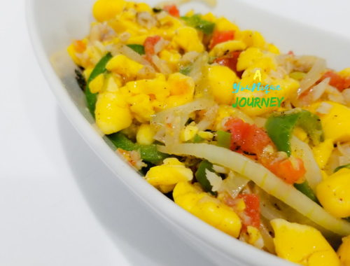 Jamaican Ackee and Saltfish in a white serving bowl.