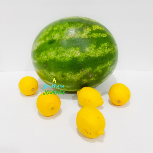 A large watermelon and five lemons.