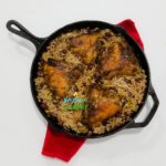 One Pot Jerk Chicken with Rice and Peas Recipe in a cast iron skillet.