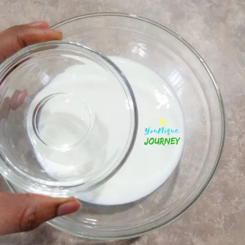 Making the homemade buttermilk by adding the vinegar to the milk.
