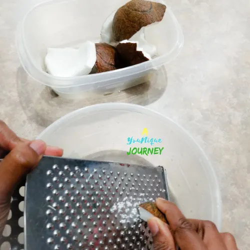 Use a box grater to grater the coconut pieces.