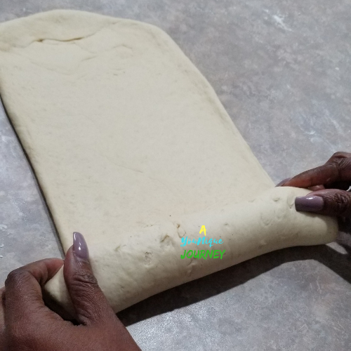 Tightly roll the dough into a log.