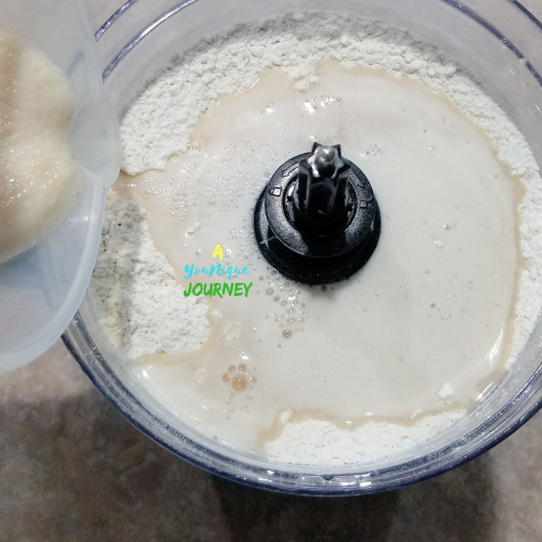 Adding the yeast mixture to the dry ingredients to make the Jamaican Hard Dough Bread Recipe.